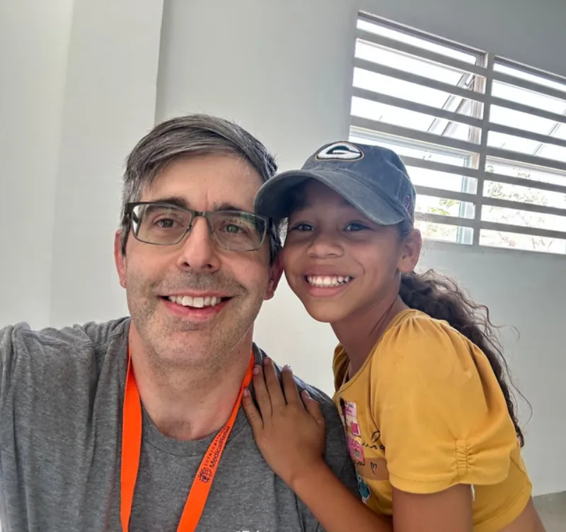 Greg Christiansen with young Patient at the Columbia Mission Trip 2024