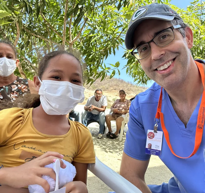 Greg Christiansen with the Patient at the Columbia Mission Trip